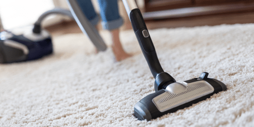 Rug cleaning by vaccum cleaner | Birons Flooring Inc