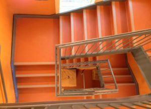Orange stairs | Birons Flooring Inc