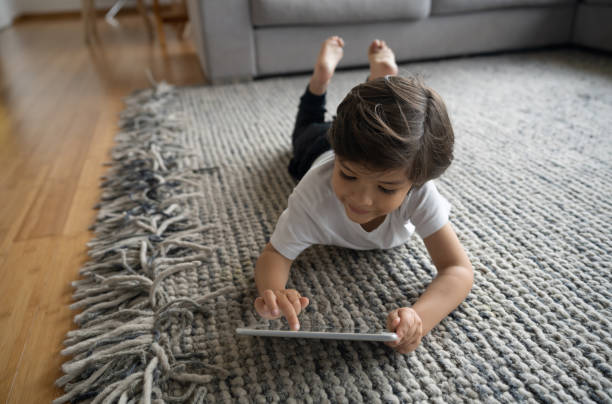 Girl lying on rug | Birons Flooring Inc