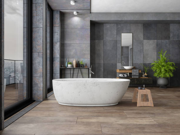 Bathroom tile dark flooring with bath tub | Birons Flooring Inc